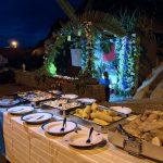 table full of food with decorated fountain in the background in Seixal Madeira