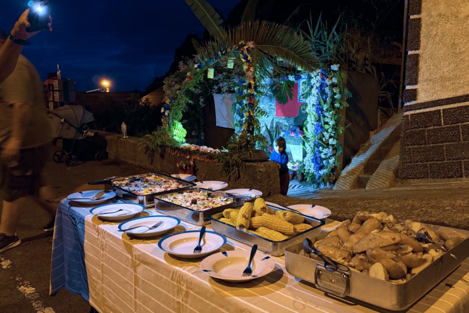 table full of food with decorated fountain in the background in Seixal Madeira
